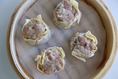 Combine the seasoning ingredients with all the chopped meat in a large mixing bowl and mix with a spatula until the mixture turns smooth.Shumai/Siu Mai Recipe